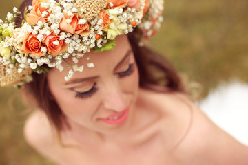 Beautiful bride wearing make up and a floral crown