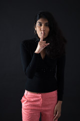 Beautiful woman doing different expressions in different sets of clothes: be quiet