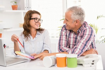 Casual designers working with colour chart
