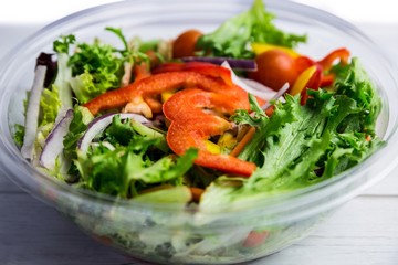 Healthy bowl of salad on table