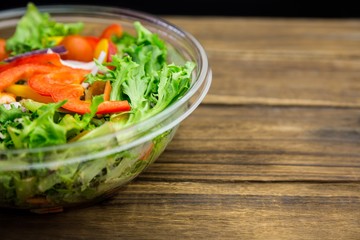 Healthy bowl of salad on table