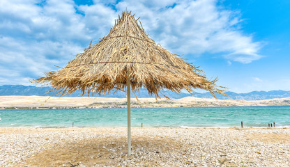 Beach umbrella on a windy day