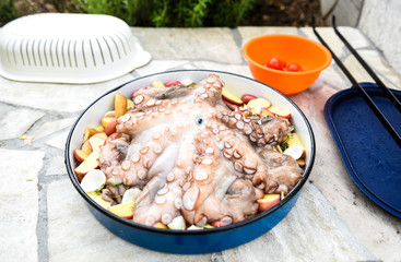 Preparing and Cooking of octopus in traditional Balkan Greek Med
