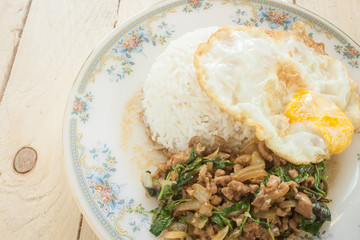 fried basil chicken fried egg thai food