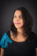 Beautiful woman doing different expressions in different sets of clothes: thinking