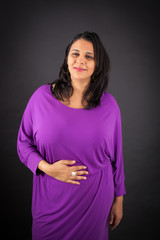 Obraz premium Beautiful woman doing different expressions in different sets of clothes: hungry