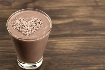 delicious chocolate shake with heart on wooden background. Cocktail, smoothies