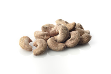 Heap Of Cashews With Skin on White Background.