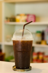 Ice coffee on the table in the cafe