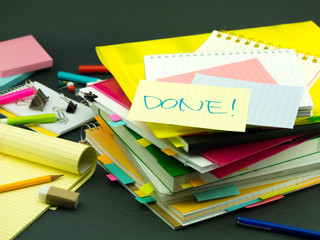 There is the huge pile of business documents on the desk.