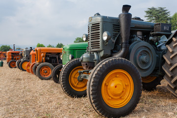 Seven old tractors in perpective, farming, agriculture