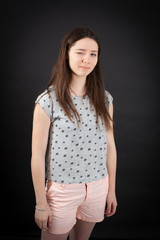 beautiful woman doing different expressions in different sets of clothes: blinking