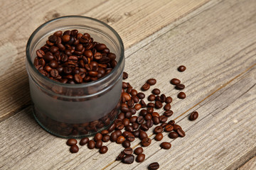 Coffee beans scattered on the table from an old tree