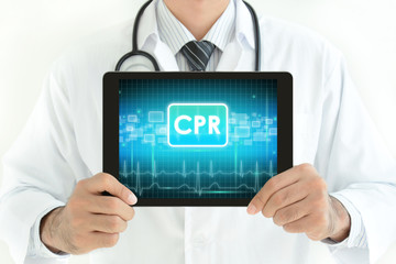 Fototapeta na wymiar Doctor holding tablet pc with CPR sign on screen