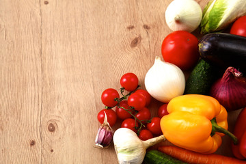 Pile of organic vegetables on a rustic wooden table