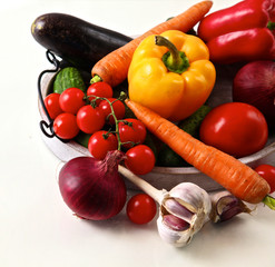 Pile of organic vegetables on a rustic wooden table
