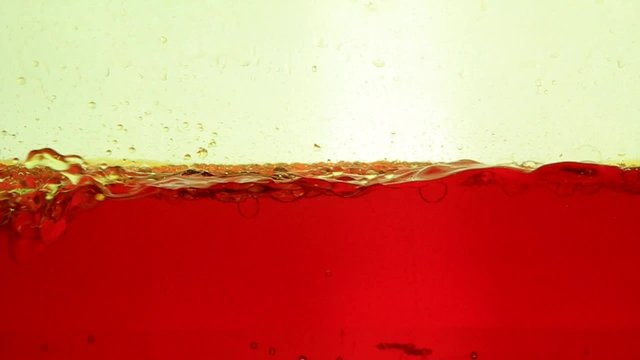Beautiful biodiesel oil shapes moving on water 