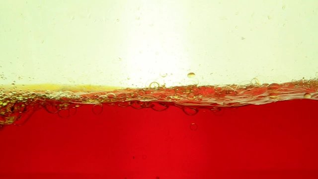 Beautiful biodiesel oil shapes moving on water 