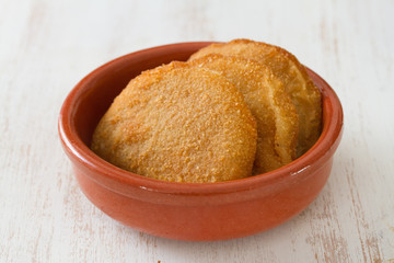 portuguese meat cookies on dish on white background