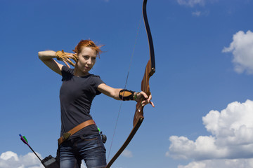 Archery woman bends bow archer target narrow - obrazy, fototapety, plakaty