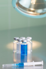Vaccine vials on a steel table