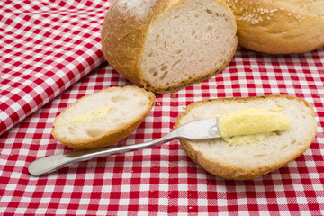 Sliced of round bread with butter