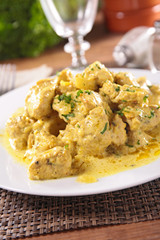 chicken cooked with curry sauce and herb