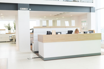 Working place of managers in a dealer's car showroom - obrazy, fototapety, plakaty
