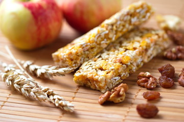 Cereal bars of granola with apples, nuts and raisins