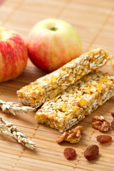 Cereal bars of granola with apples, nuts and raisins