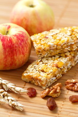 Cereal bars of granola with apples, nuts and raisins