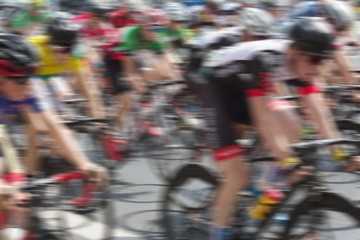 Obraz premium bicycle race , group of people on bikes - motion blur