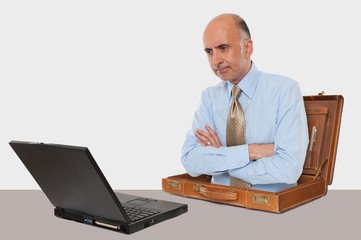 Business man working with his laptop at desk