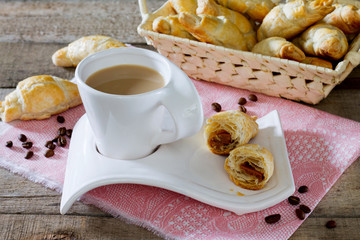 Fresh homemade croissants and French cup of hot coffee