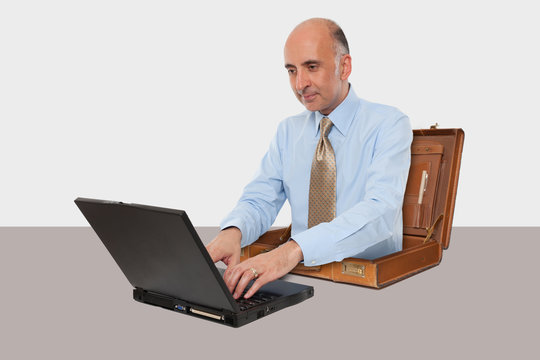 Business man working with his laptop at desk