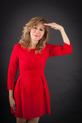 Beautiful woman doing different expressions in different sets of clothes: at attention