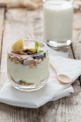 Yogurt with muesli in small glass.