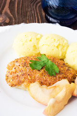 Baked chicken cutlet with apples, selective focus
