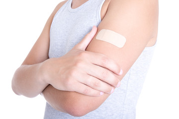 male shoulder with medical adhesive patch isolated on white - obrazy, fototapety, plakaty