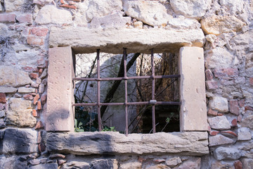 old window grille of a ruined castle