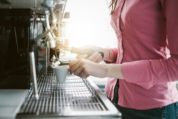 Waitress making coffee