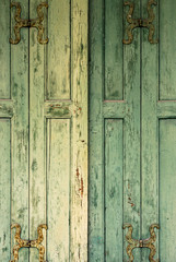 Detail of green wooden shutters.