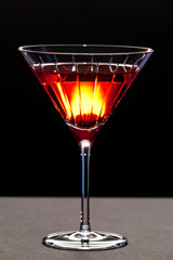 Red cocktail in a martini glass