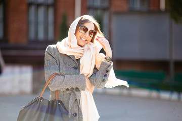 Fototapeta premium girl in a coat on the street