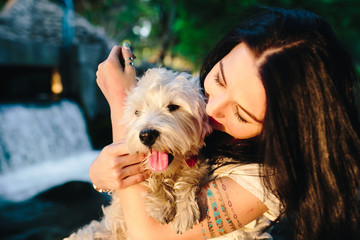 girl playing with a dog