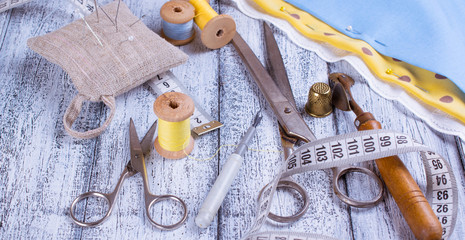Tools for sewing and fabric on wooden boards