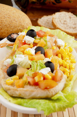 mixed salad with bread and various cereals (pansanella)