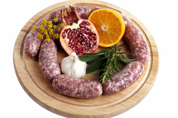 Pork chops and sausage with orange and pomegranate