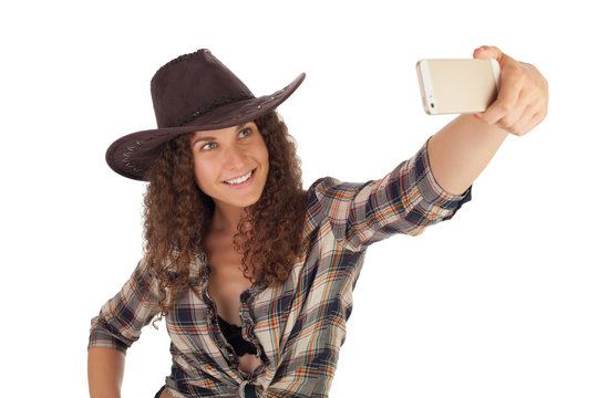Pretty girl make a self portrait with her smartphone.