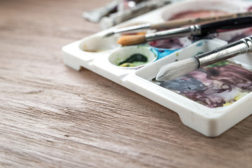 Paintbrushes and paint box